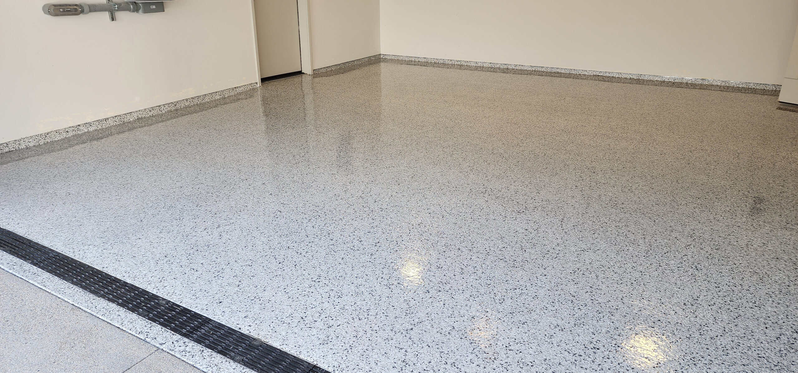 Tan flake epoxy garage floor with a clean satin finish